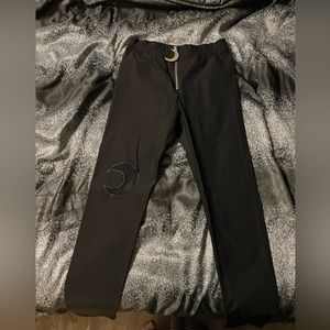 Skinny black moon zipper pants